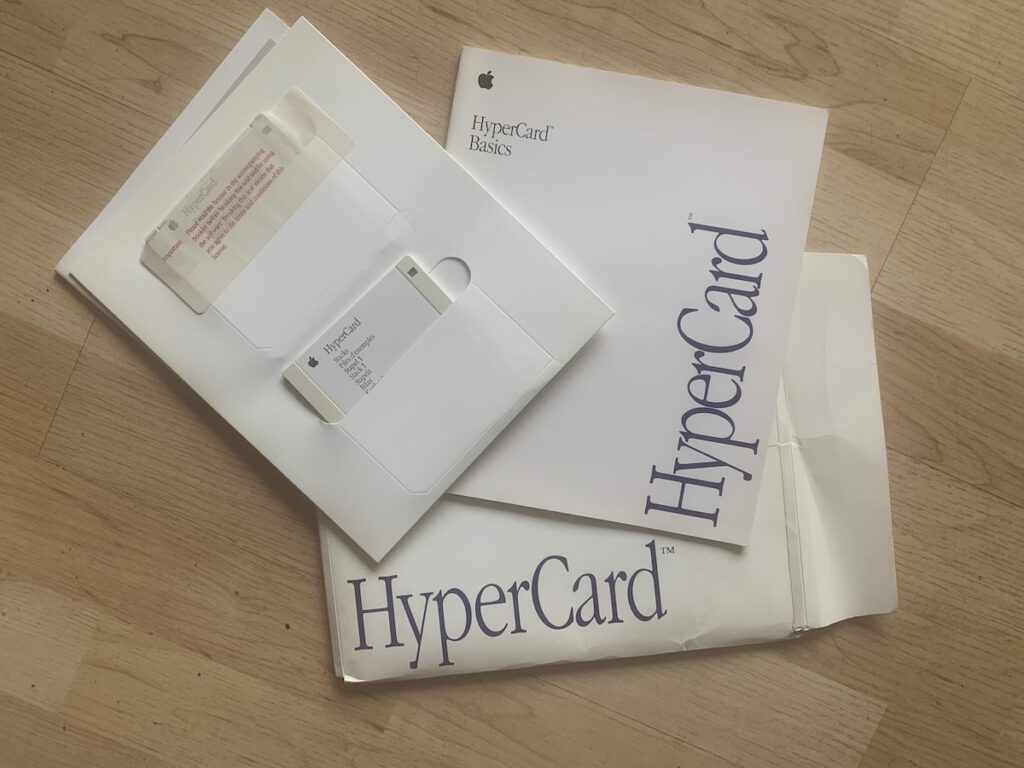 HyperCard Packaging, with floppy disks sitting in slots and Bascis booklet.