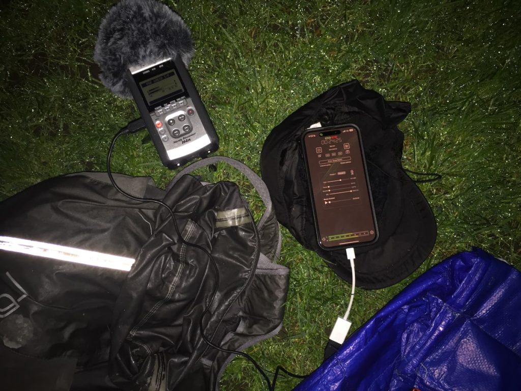 Audio setup in the dark. H4N recorder with dead cat, connected to iPhone