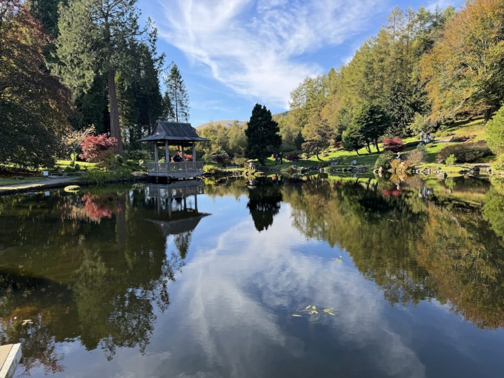 apanese garden with a pond, trees, and a wooden gazebo in Cowden.